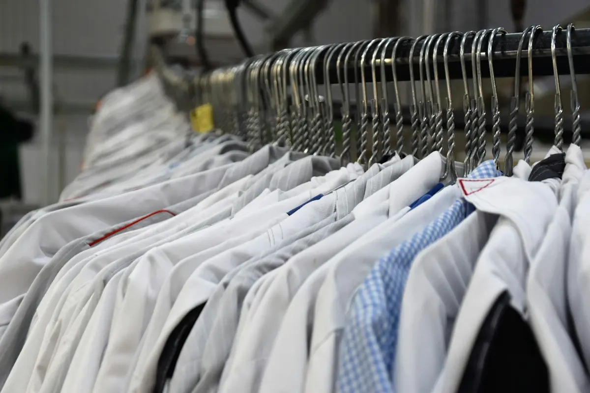 Cleaned garments hanging ready for collection