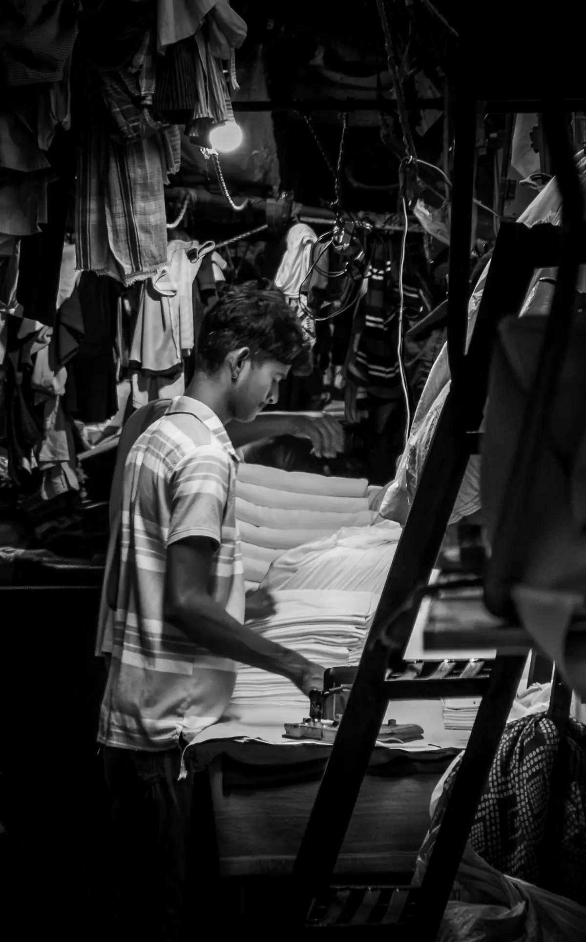 Pressing a stack of laundered linens