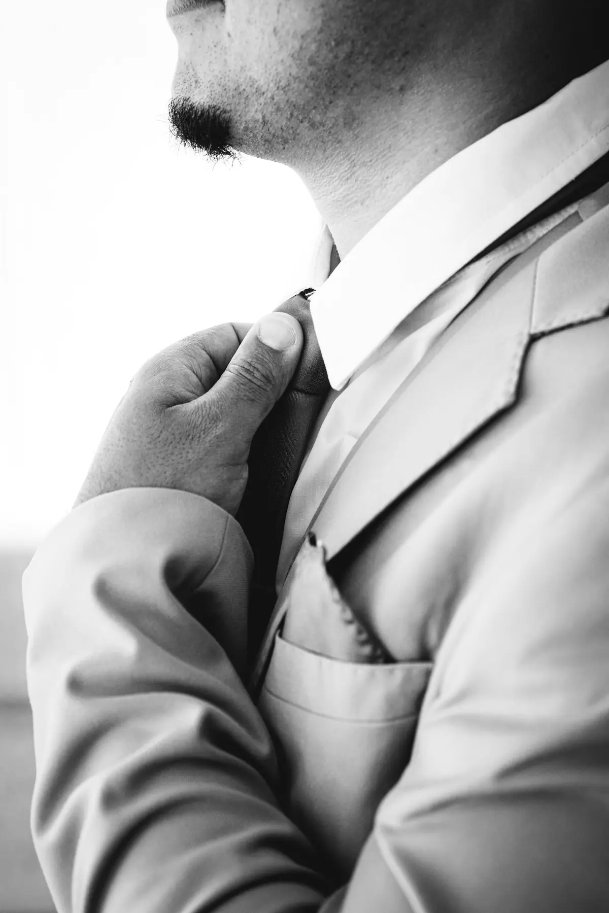 The collar and lapel of a tailored jacket
